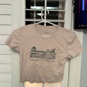 Beige PacSun graphic baby tee and black Abercrombie and Fitch ribbed tee